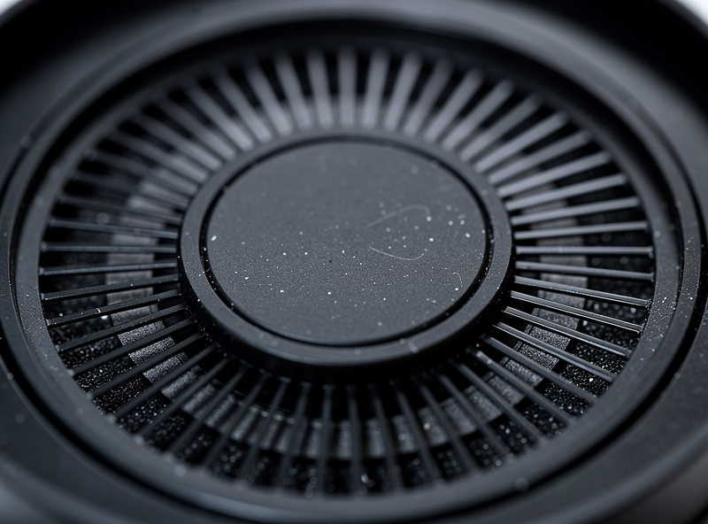 Planar magnetic headphone driver visible through open-back grille