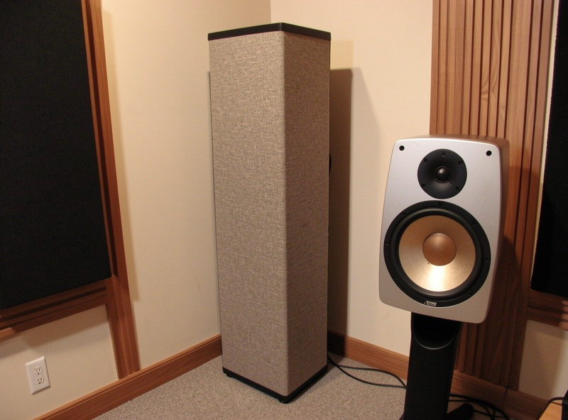 Floor-to-ceiling corner bass trap installed in the front corner of a hi-fi listening room