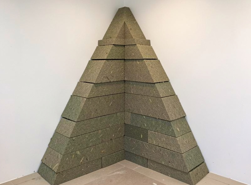 Superchunk style triangular bass trap filled with mineral wool in a room corner