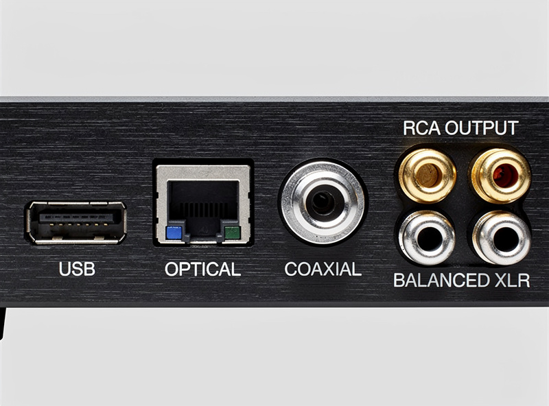Rear panel of a DAC showing USB, optical, coaxial inputs and RCA plus XLR outputs