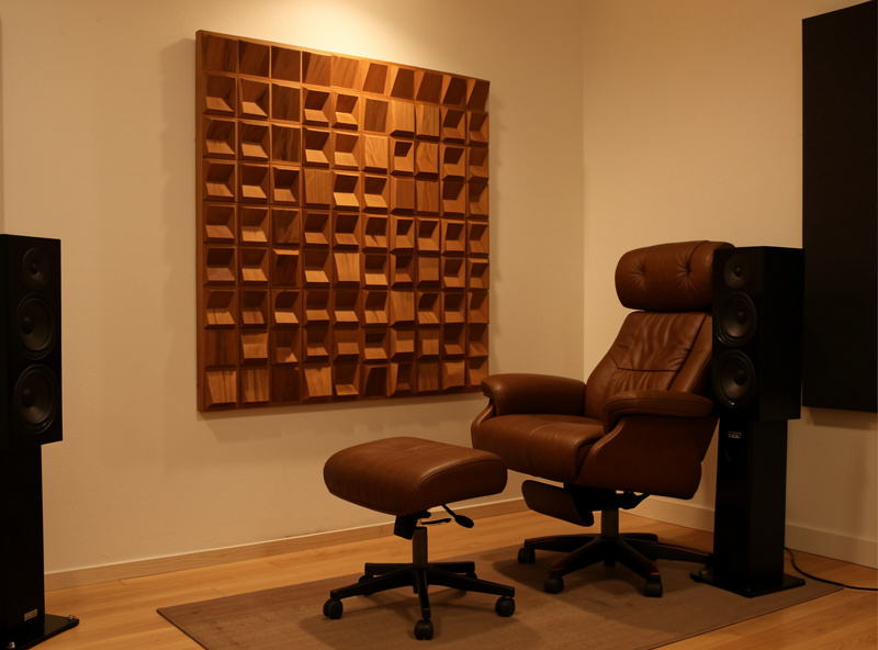 Quadratic diffuser mounted on the rear wall behind the listening seat in a hi-fi room