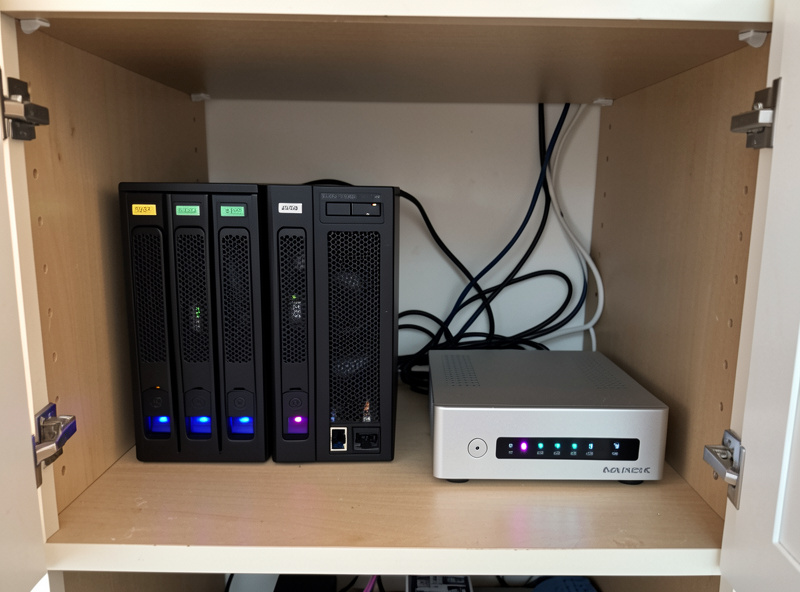 Two-bay NAS and small fanless server in a cupboard serving a music library