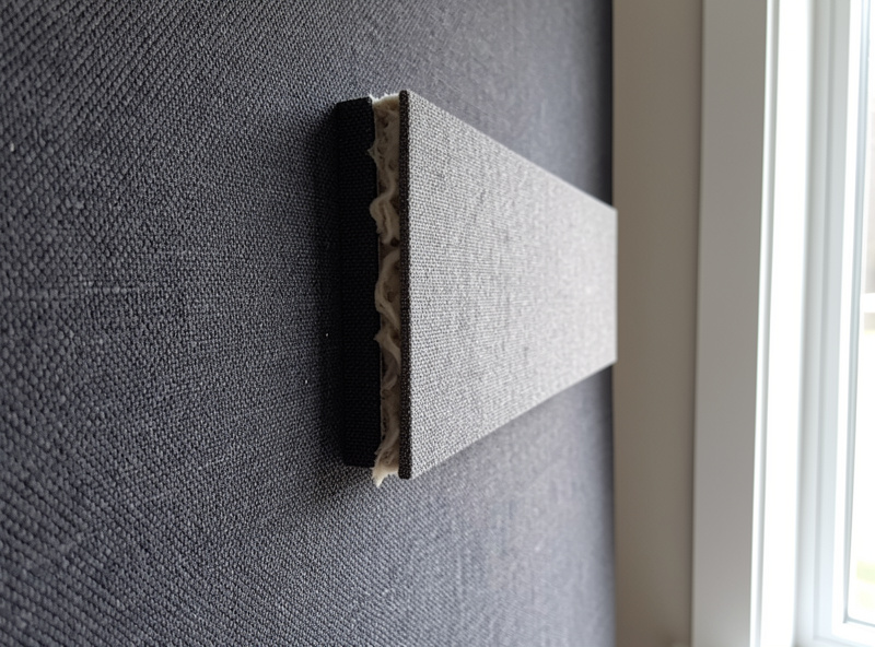 Small treated hi-fi listening room with broadband absorber panels at the side wall first reflection points